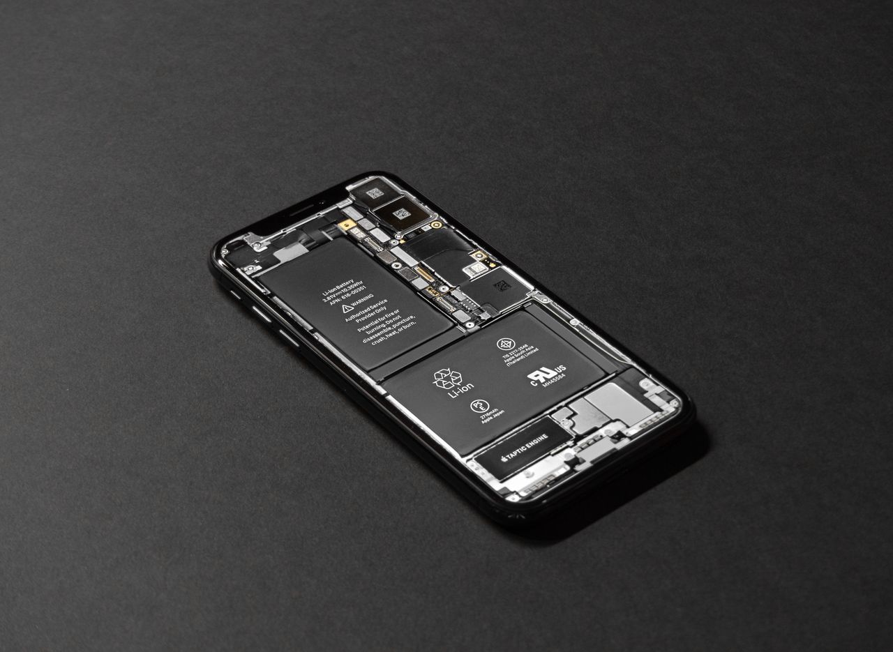 Crafting Captivating Headlines: Your awesome post title goes here High-resolution image of a smartphone showcasing its internal components on a dark surface.